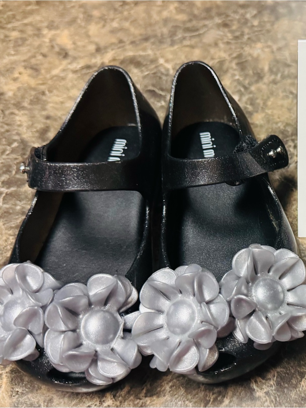 Mini Melissa Black Girls' Mary Janes with Silver Flower Appliqués